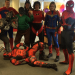 people dressed as superheroes for charity event