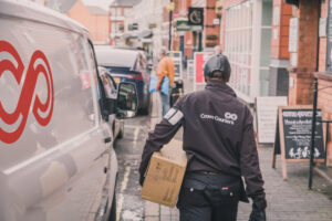 Crown Couriers courier delivering parcel
