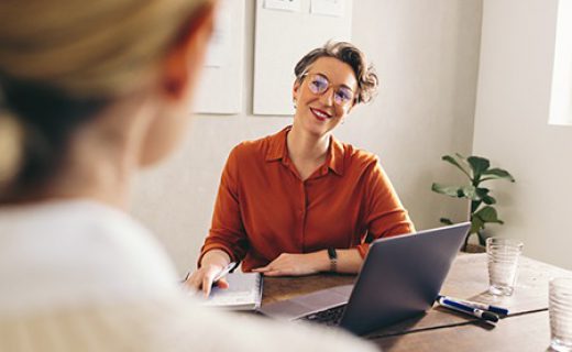 Happy,Hiring,Manager,Smiling,While,Interviewing,A,Job,Candidate,In Happy hiring manager smiling while interviewing a job candidate in her office. Cheerful businesswoman having a meeting with a shortlisted job applicant in a creative workplace.