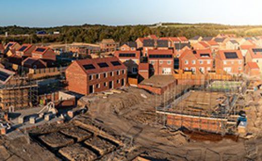 Aerial panoramic landscape view of a new build housing estate with houses under construction to fill the gap in the UK home shortage and supplement the UK Government's Right To Buy policy