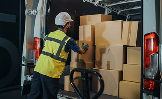 Handsome,Latin,Male,Worker,Wearing,Hard,Hat,Loads,Cardboard,Boxes Handsome Latin Male Worker Wearing Hard Hat Loads Cardboard Boxes into Delivery Truck. Delivering Online Orders, E-Commerce Goods, Food, Medicine Supply. Overworked Tired Frontline Hero Doing Job